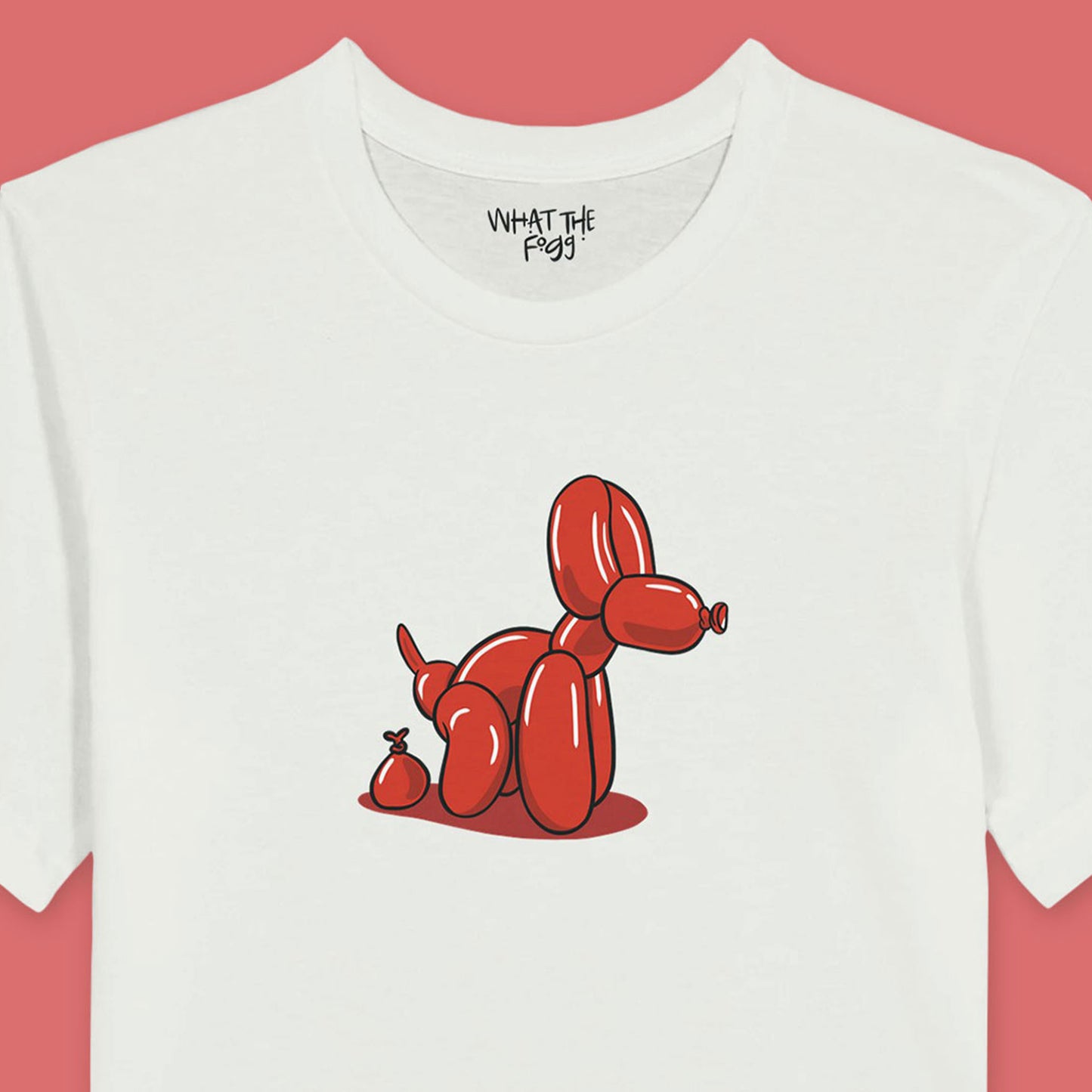 Close Up of a White t-shirt featuring a humorous illustration of a balloon dog in the center of the front. The balloon dog is depicted as pooping out a smaller balloon shaped like poop.