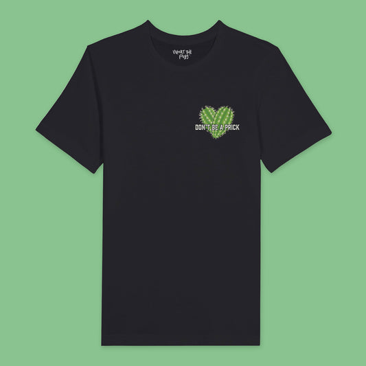 Black t-shirt featuring a chest badge with an illustration that reads 'Don't Be a Prick.' The design includes two cactuses arranged in the shape of a heart behind the text."