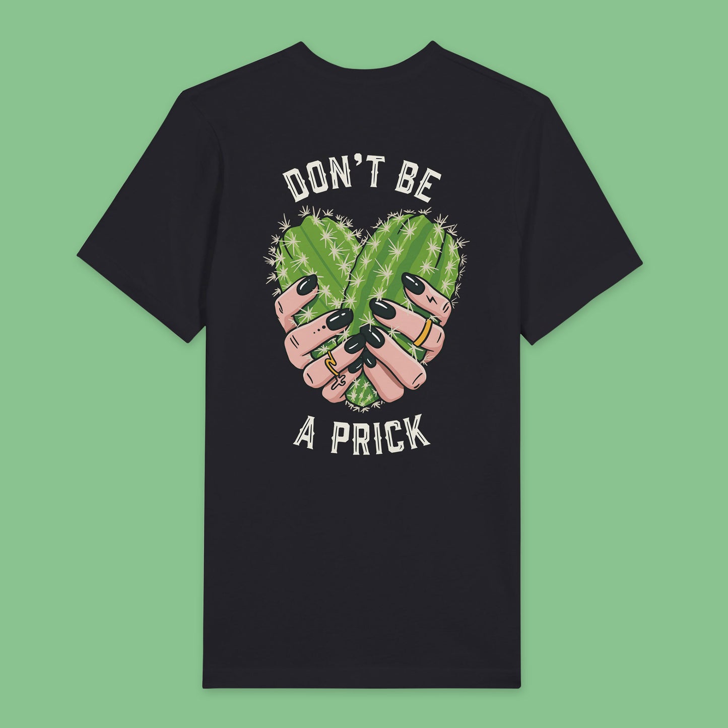 Back view of Black t-shirt featuring a design of two cactuses arranged in the shape of a heart with text around it reading don’t be a prick.