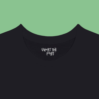 Close-up of the inside label on a black T-shirt, showing the text 'What the Fogg.