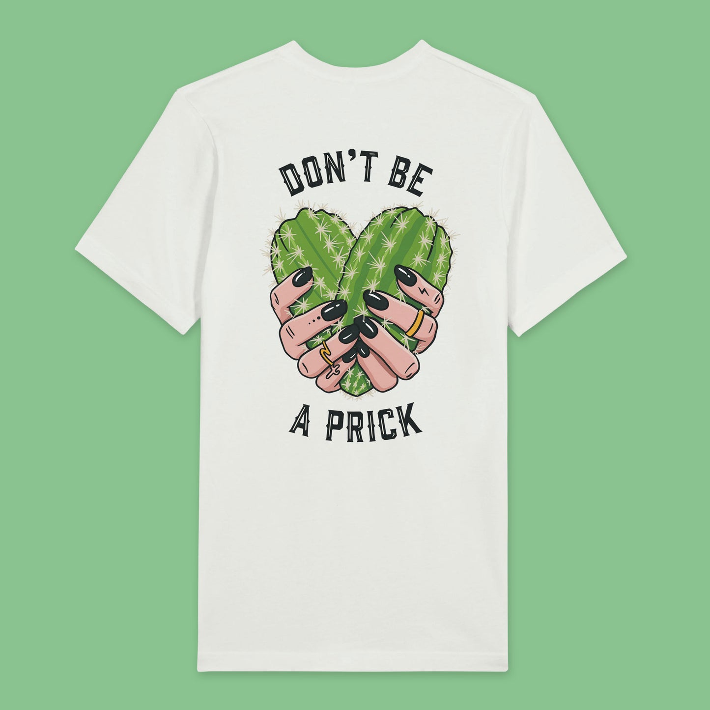 Back view of white t-shirt featuring a design of two cactuses arranged in the shape of a heart with text around it reading don’t be a prick.
