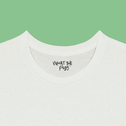 Close-up of the inside label on a white T-shirt, showing the text 'What the Fogg.