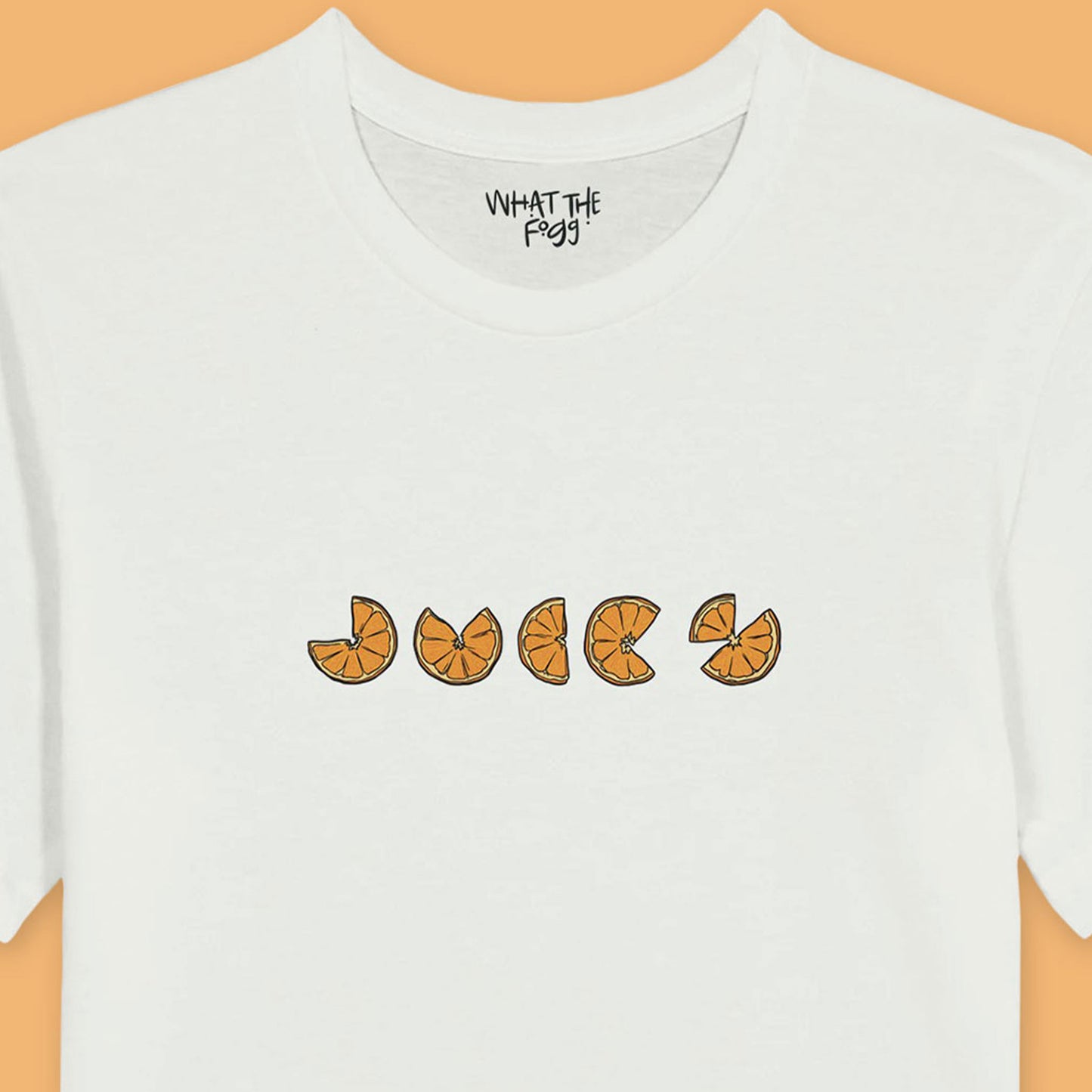 Close up of White t-shirt with the word 'Juicy' written in oranges, centred on the front. 
