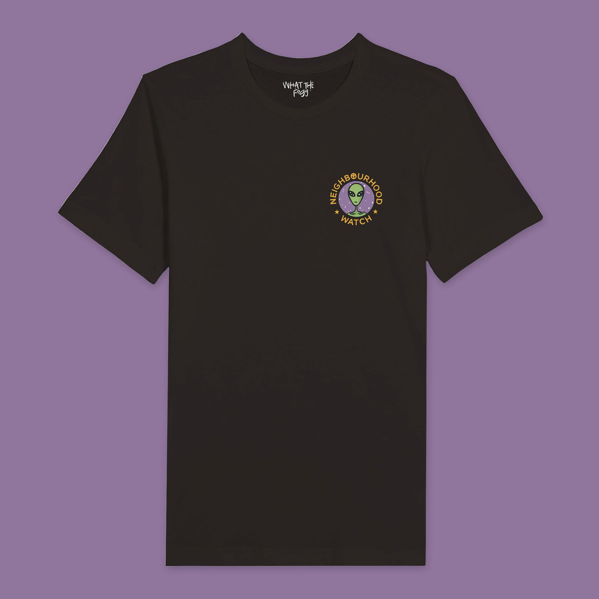 Black t-shirt featuring a playful twist on the traditional Neighbourhood Watch poster. The front of the shirt displays a circular badge with a design of aliens instead of people. The badge is surrounded by the text 'Neighbourhood Watch' in a bold, eye-catching font.