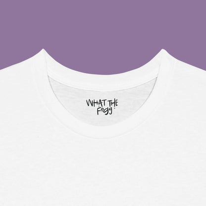 Close-up of the inside label on a white T-shirt, showing the text 'What the Fogg.