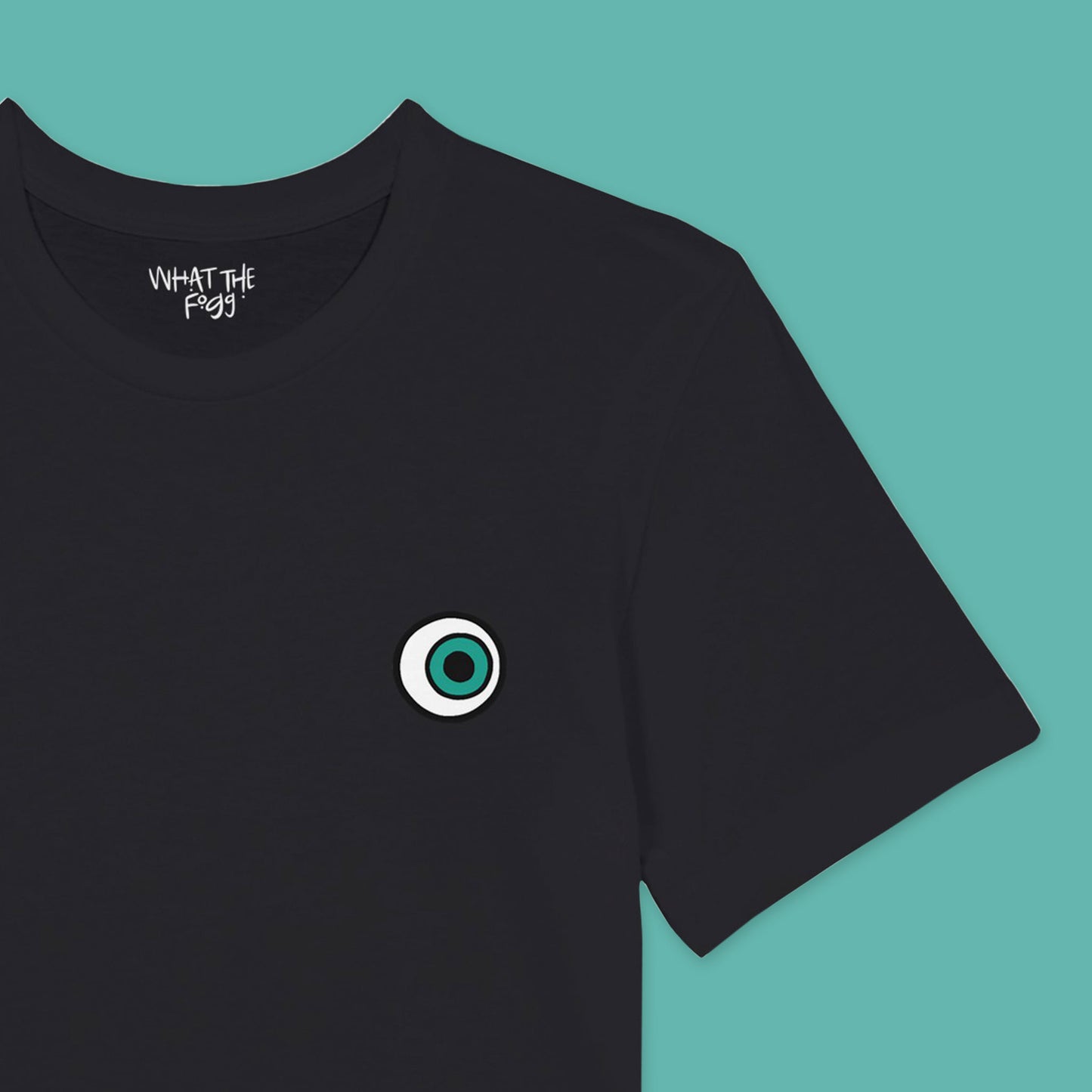 Close up of Black T-shirt with Eyeball printed on left chest of front.