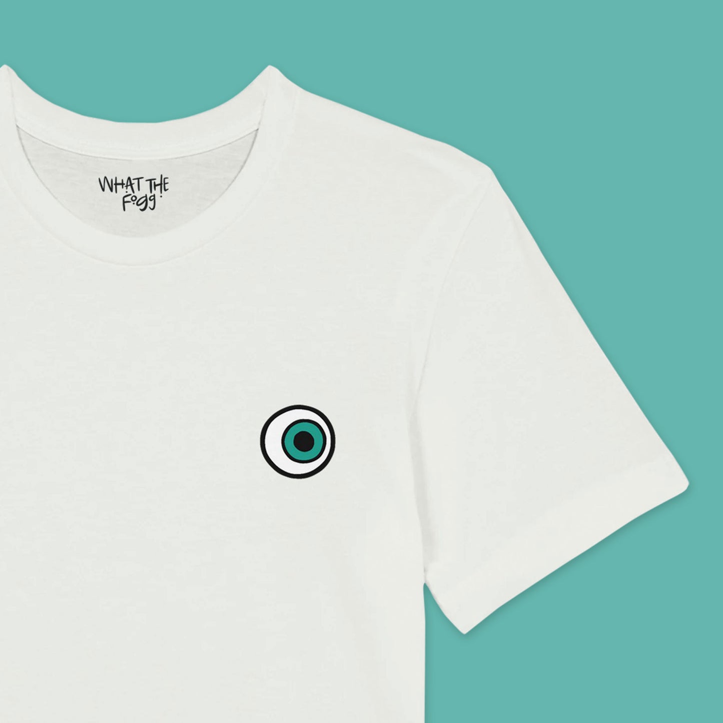 Close up of White T-shirt with Eyeball printed on left chest of front.