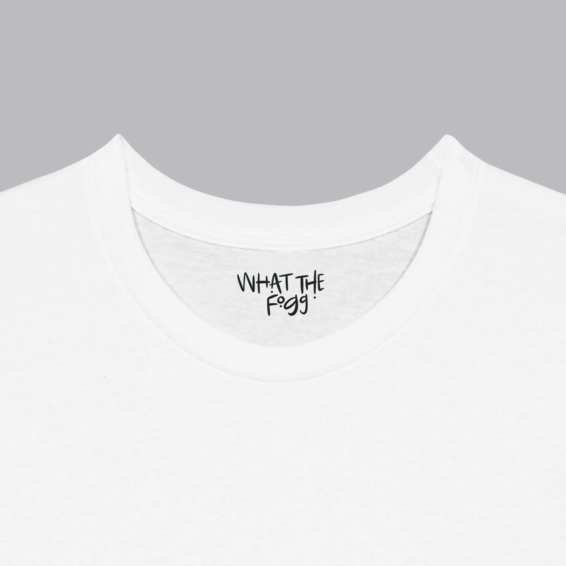 Close-up of the inside label on a white T-shirt, showing the text 'What the Fogg.