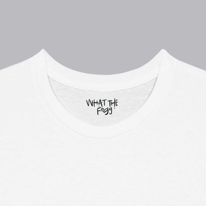 Close-up of the inside label on a white T-shirt, showing the text 'What the Fogg.