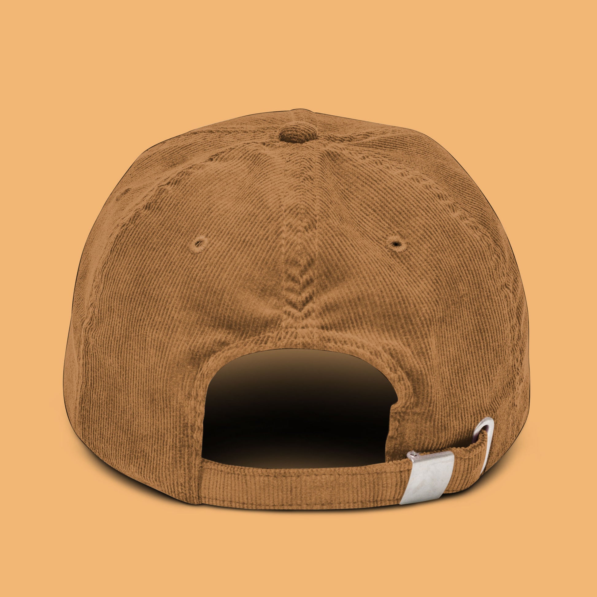 Back-angle view of a camel-colored corduroy hat with 'Weird Times' printed in white on the front.