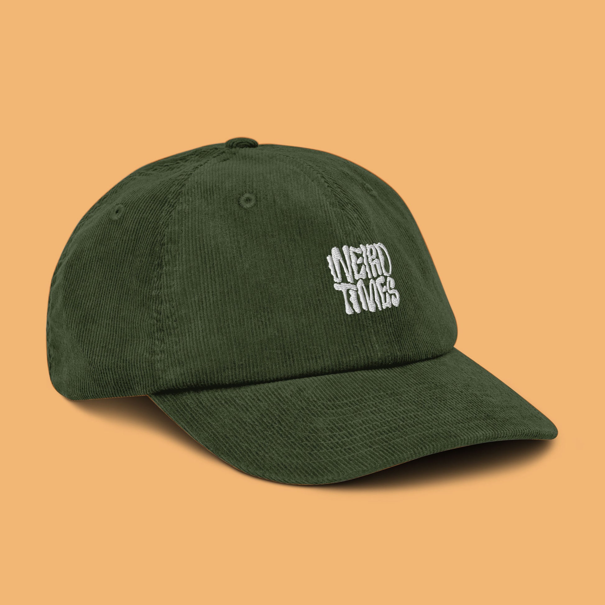 Front-side angle of a dark olive-coloured corduroy hat with 'Weird Times' printed in white on the front.